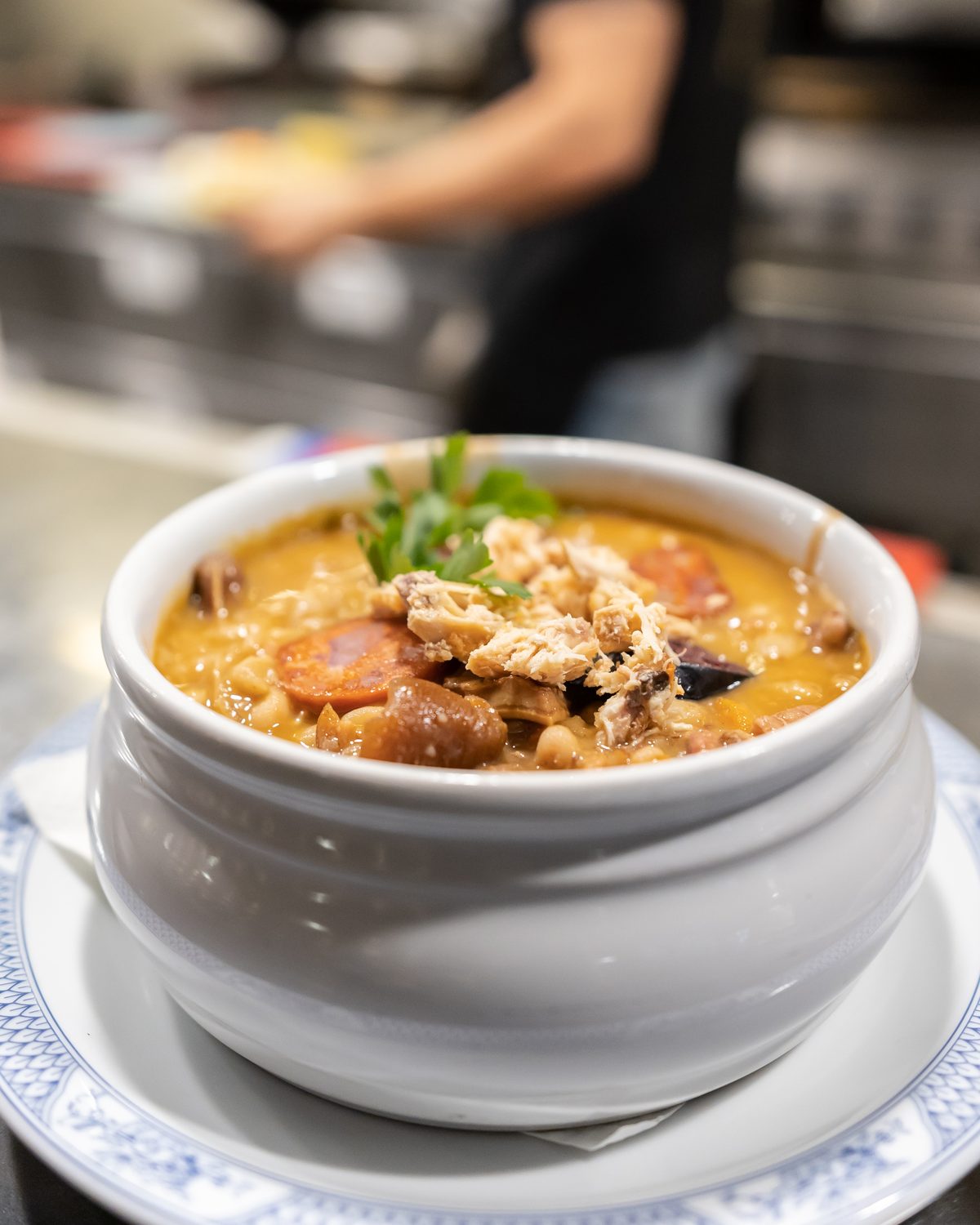 Tripas à moda do Porto, bean and tripe stew in a white tureen